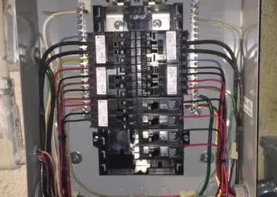 A fuse box with wires attached to it.