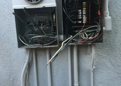 An electrical box with wires attached to it.