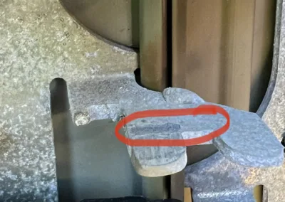 A piece of metal with a red circle on it.