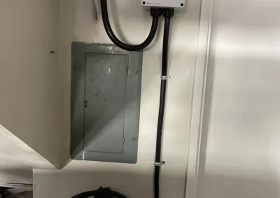 A electrical box with wires attached to it.