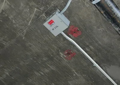 The ceiling of a building with a fire hydrant.